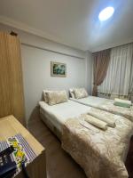 A bed or beds in a room at Amore Hotel Istanbul