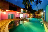 a swimming pool in a resort at night at Dickman Resort "The Boutique Hotel" in Negombo