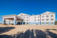 a large white building with a large driveway at Comfort Suites Roanoke - Fort Worth North in Roanoke