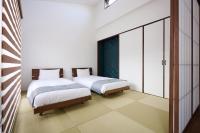 Hotel & Villa Seahorse MIYAKOJIMAにあるベッド