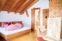 A bed or beds in a room at Kinderbauernhof Ierzerhof