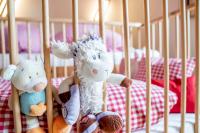 A bed or beds in a room at Kinderbauernhof Ierzerhof