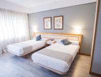 Posteľ alebo postele v izbe v ubytovaní Hotel Alda Boiro
