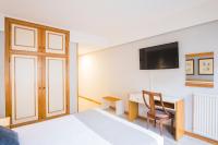 Posteľ alebo postele v izbe v ubytovaní Hotel Alda Boiro