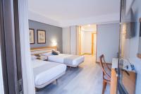 Posteľ alebo postele v izbe v ubytovaní Hotel Alda Boiro