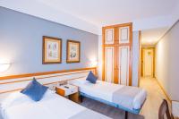 Posteľ alebo postele v izbe v ubytovaní Hotel Alda Boiro