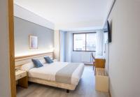 Posteľ alebo postele v izbe v ubytovaní Hotel Alda Boiro