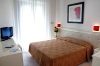 Posteľ alebo postele v izbe v ubytovaní Hotel Athena