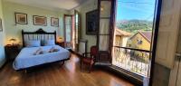 Postel nebo postele na pokoji v ubytování La Casona de La Vega junto a Cangas de Onís