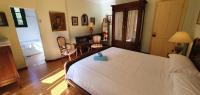 Postel nebo postele na pokoji v ubytování La Casona de La Vega junto a Cangas de Onís