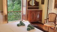 Postel nebo postele na pokoji v ubytování La Casona de La Vega junto a Cangas de Onís
