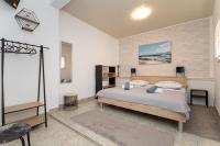 Postel nebo postele na pokoji v ubytování Apartments Ivan