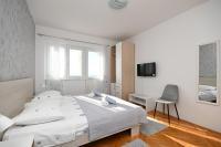 Postel nebo postele na pokoji v ubytování Apartments Ivan