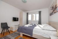 Postel nebo postele na pokoji v ubytování Apartments Ivan