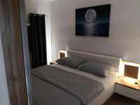 Posteľ alebo postele v izbe v ubytovaní Apartment Tomi