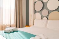 A bed or beds in a room at La Via del Mare