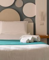 A bed or beds in a room at La Via del Mare