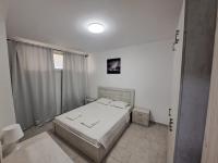 A bed or beds in a room at SYKA Thassos - Villa 4 Rooms SKALA RACHONIOU