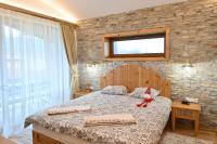 Postel nebo postele na pokoji v ubytování Villa Letizia near the Pirin Golf Resort