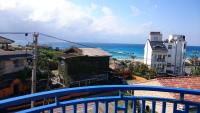 a view of the ocean from a balcony at Haisu Homestay in Eluan