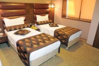 Postel nebo postele na pokoji v ubytování Marlight Boutique Hotel