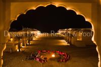 a row of tents with lights in the dark at Desert Dream Royal Camp &amp; Pool in Jaisalmer