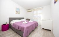 Postel nebo postele na pokoji v ubytování Holiday Apartment Makarska 3