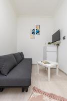 Televízia a/alebo spoločenská miestnosť v ubytovaní Real Apartments Kertész II.