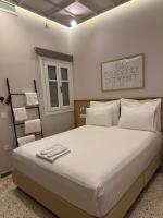 Posteľ alebo postele v izbe v ubytovaní Belle Athenes - Luxury Rooms at Monastiraki Railway Station