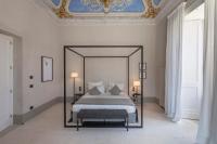Posteľ alebo postele v izbe v ubytovaní Palazzo Tafuri Boutique Hotel