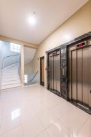 an empty hallway with elevators in a building at DELPLAZA Timbiras São Paulo in São Paulo