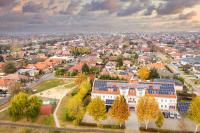 an aerial view of a town with houses and trees at Platan Hotel in Debrecen