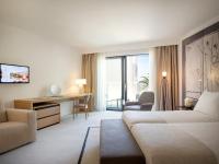 Posteľ alebo postele v izbe v ubytovaní Hotel Kompas