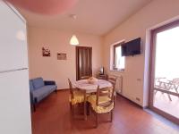 A television and/or entertainment centre at Mirèa Apartment by Casa in mente