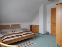 Łóżko lub łóżka w pokoju w obiekcie Familien Zeit