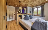 Łóżko lub łóżka w pokoju w obiekcie Chalet Wallehen