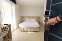 A bed or beds in a room at Aparthotel Solifemar