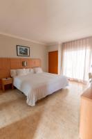 A bed or beds in a room at Aparthotel Solifemar
