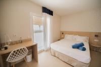 A bed or beds in a room at Aparthotel Solifemar