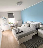 Łóżko lub łóżka w pokoju w obiekcie Apartman Botivo