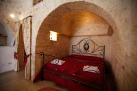 Posteľ alebo postele v izbe v ubytovaní Trulli e Puglia Resort