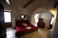 Posteľ alebo postele v izbe v ubytovaní Trulli e Puglia Resort