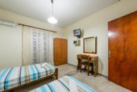 A bed or beds in a room at Borsalino Studios & Apartments