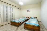 A bed or beds in a room at Borsalino Studios & Apartments