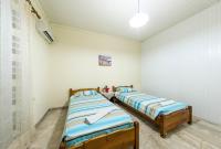 A bed or beds in a room at Borsalino Studios & Apartments