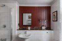 a bathroom with a sink and a mirror at The Brewers Inn in London