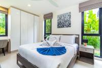 Postel nebo postele na pokoji v ubytování Phuket villa in Laguna Park