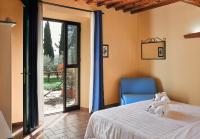 A bed or beds in a room at Agriturismo San Sano