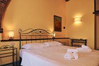 A bed or beds in a room at Agriturismo San Sano