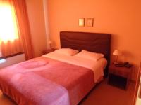 Posteľ alebo postele v izbe v ubytovaní Bell Air Hotel